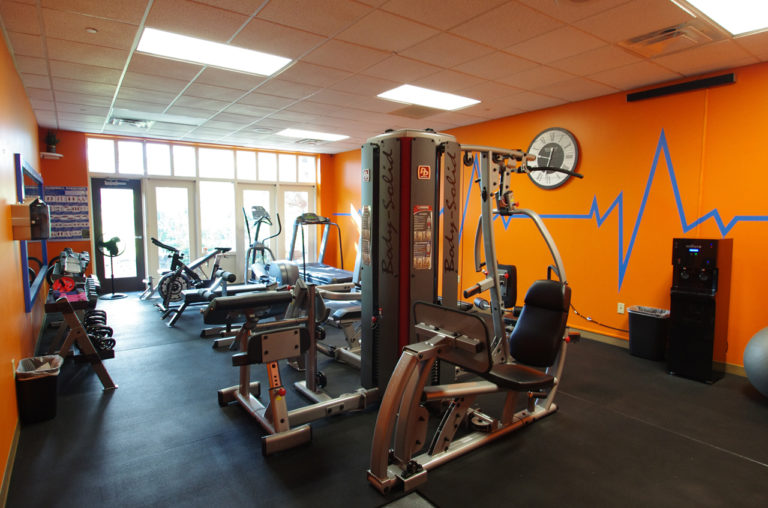 On-site gym with cardio and strength training equipment