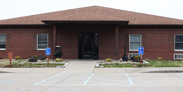 Men’s House brick building front entrance