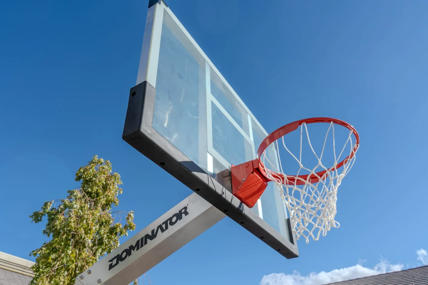 Basketball hoop and backboard under clear sky