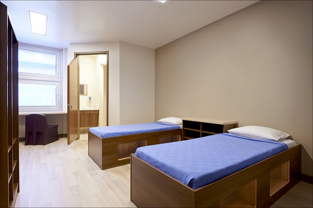 Two-bed rehab room with modern furniture and private bath