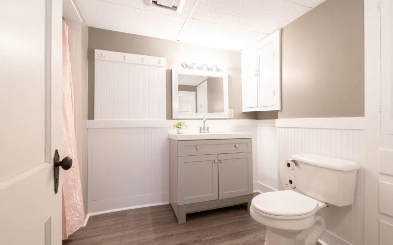 Clean bathroom with vanity and toilet