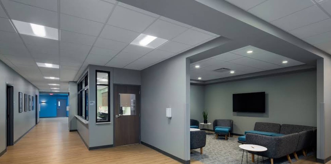 Common lounge area with seating adjacent to treatment spaces