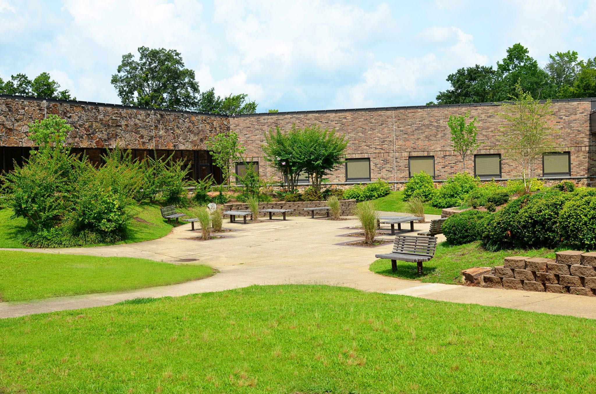 Landscaped courtyard with benches and walking paths