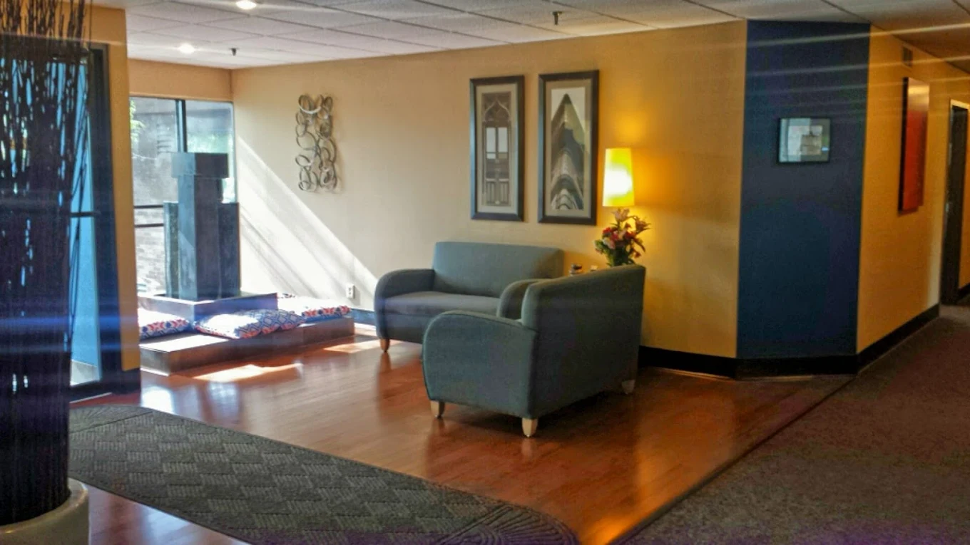 Bright waiting area with seating and decorative artwork