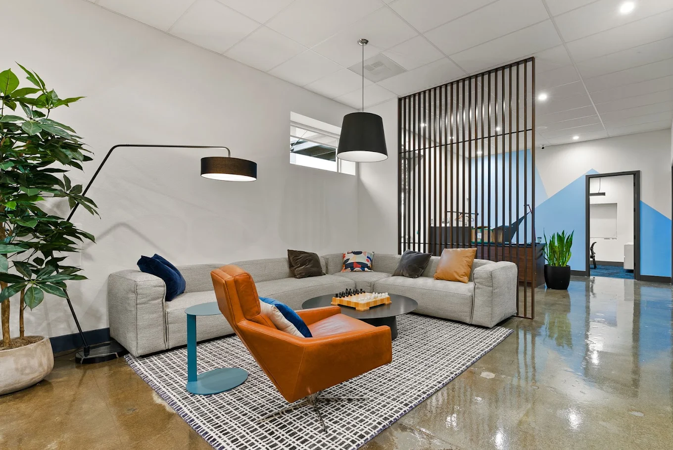Modern client lounge with sectional sofa and seating area