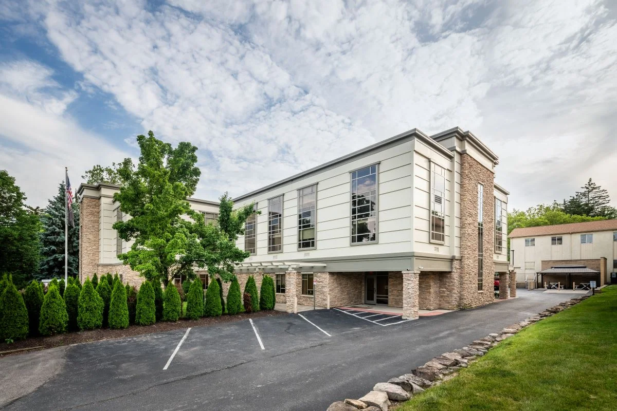 Modern rehab building with stone and cream walls