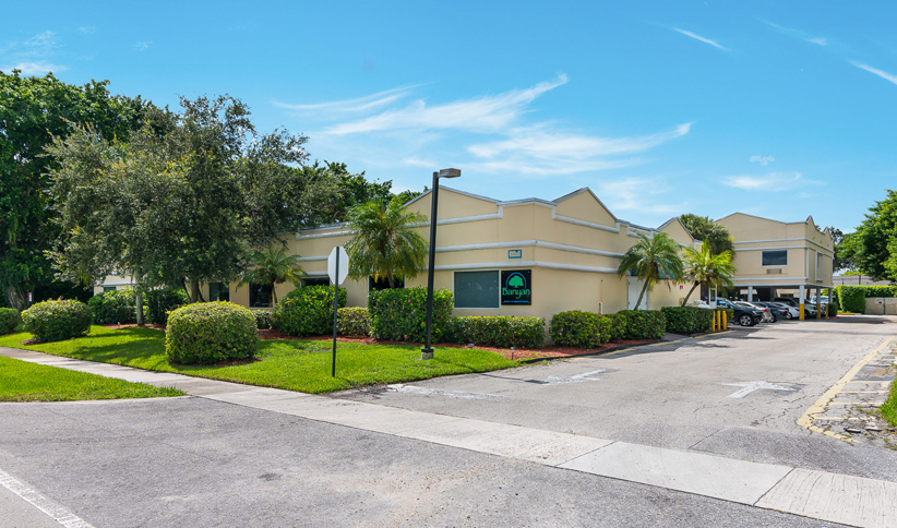 Facility exterior driveway with accessible parking.