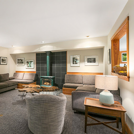 Lounge with sofas and a fireplace.