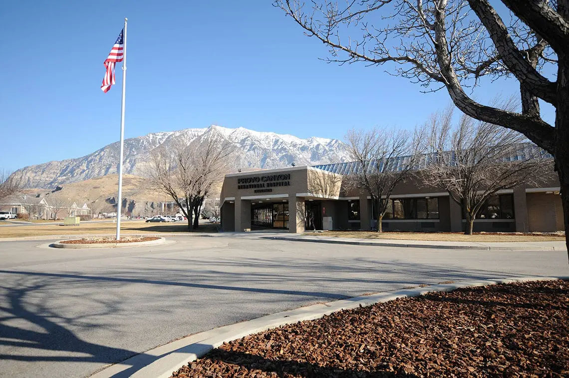 Facility entrance with mountains in background