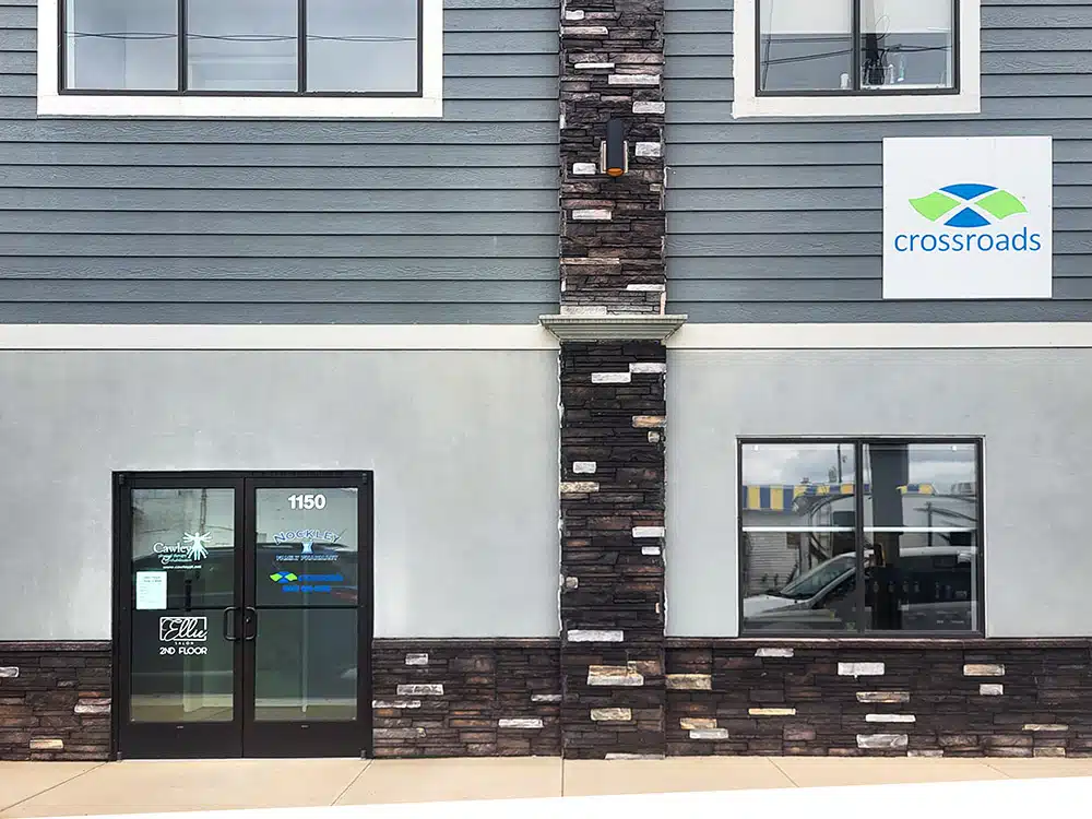 Exterior of Crossroads clinic with entrance doors and signage
