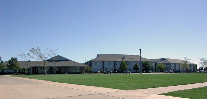 Large rehab facility with open lawn and multiple connected buildings