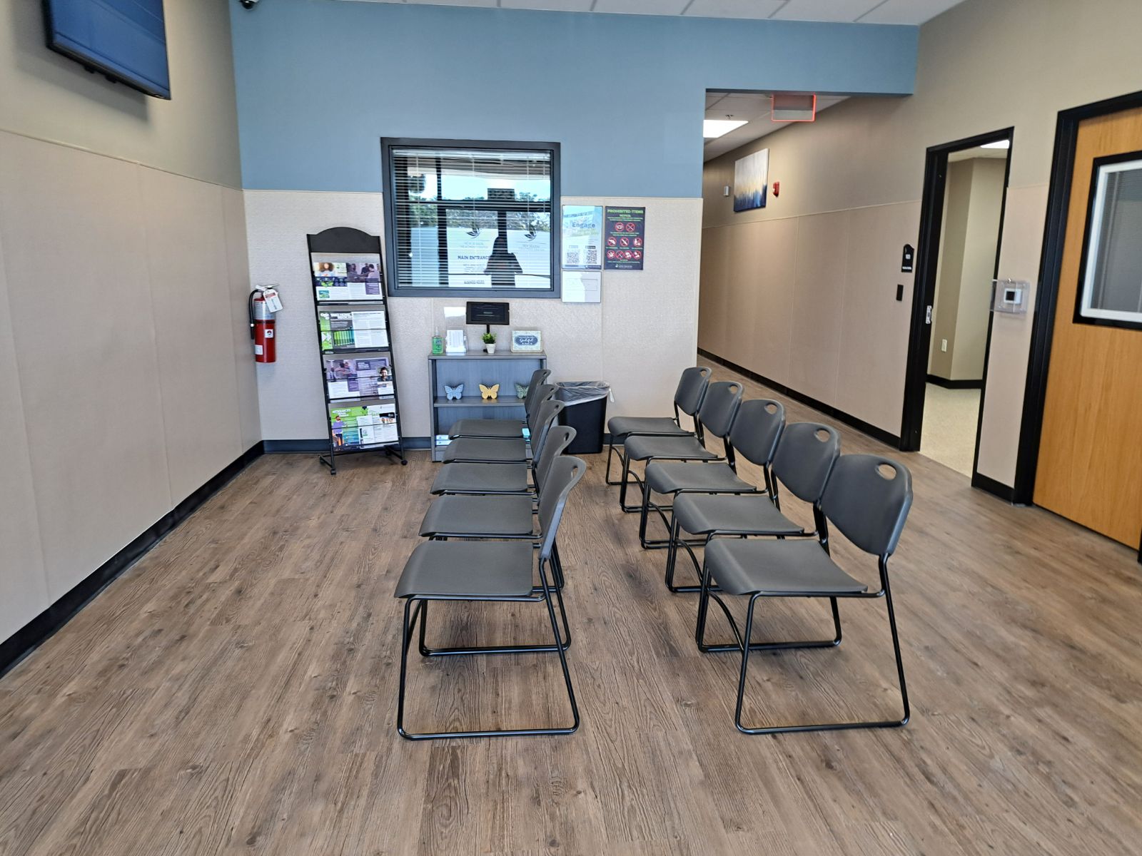 Chairs arranged in a clean, quiet clinic waiting area.
