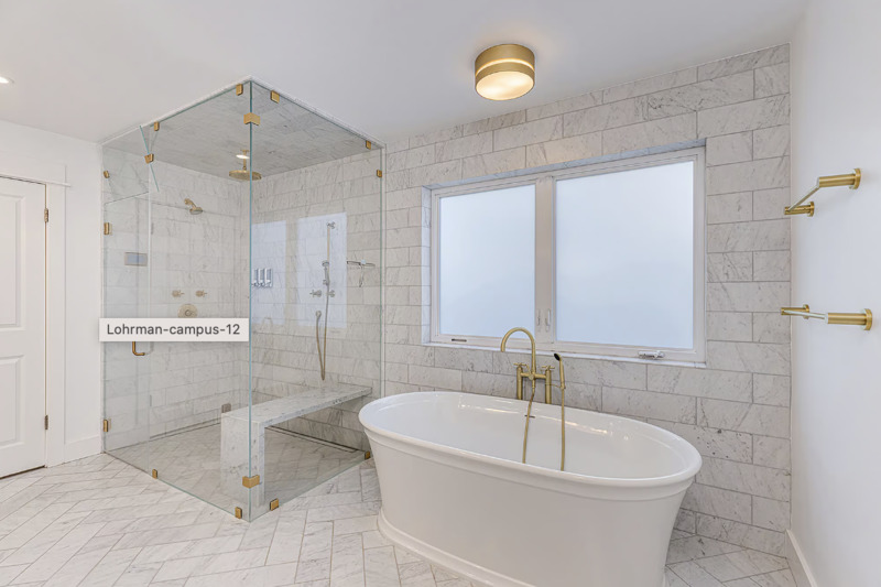 Modern rehab bathroom with glass shower and soaking tub