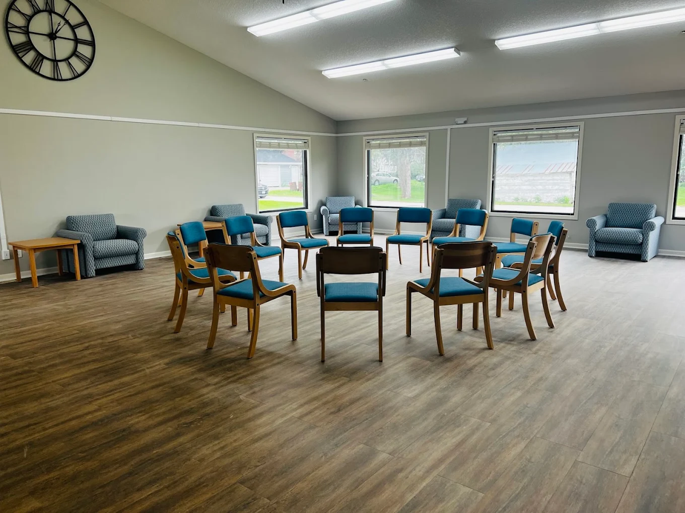 Spacious meeting room with chairs arranged around tables