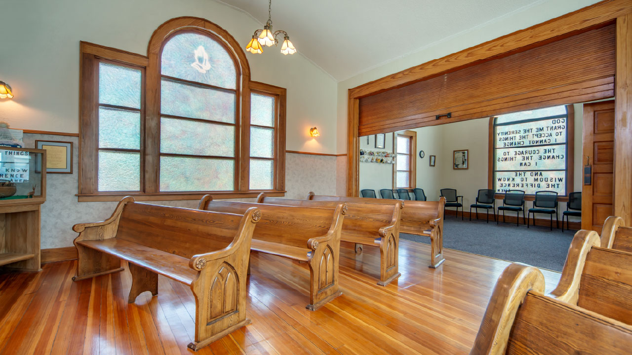 Chapel with wooden pews for reflection and spiritual support
