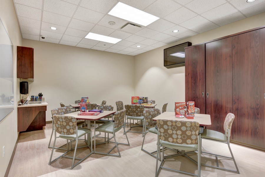 Game room with tables and board games for group activities