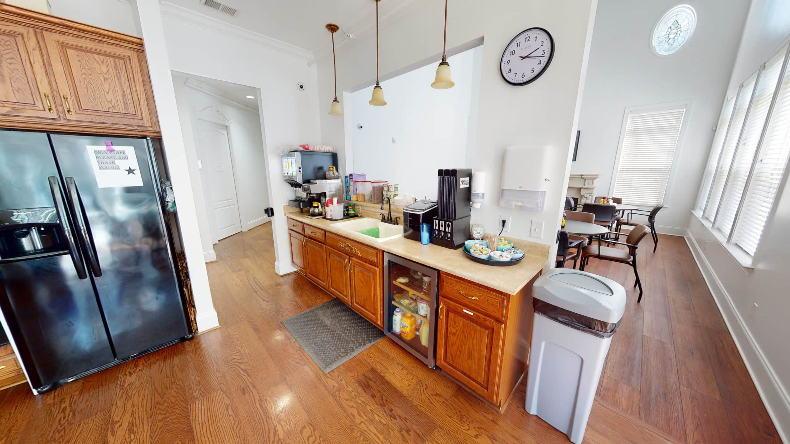 Kitchen with wood cabinets and beverage station