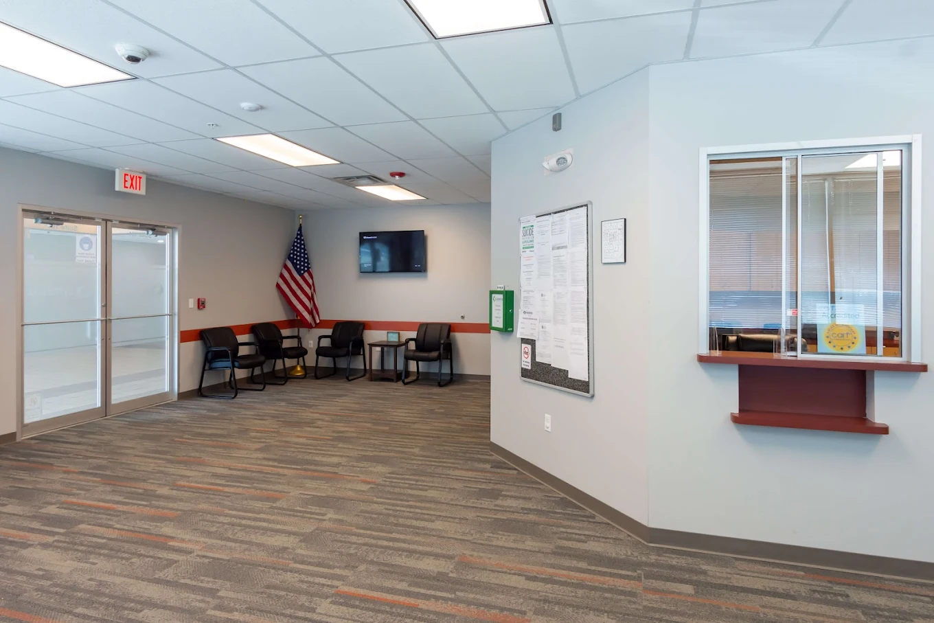 Chairs and check-in window in reception area