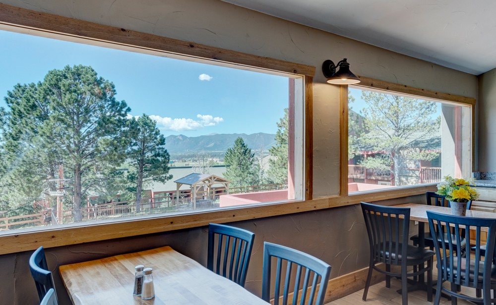 Dining area with tables and chairs.