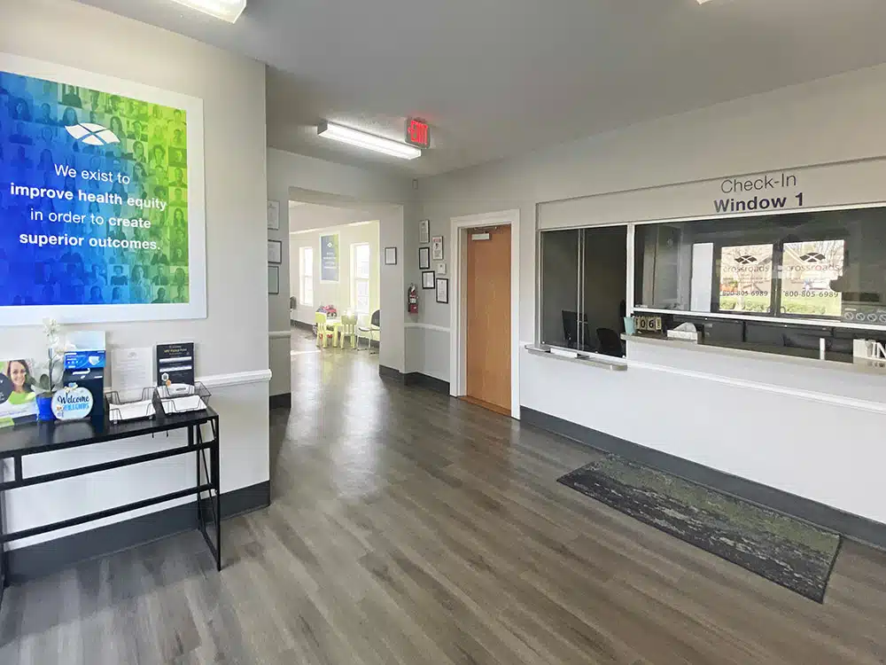 Clean lobby with check-in window and seating area