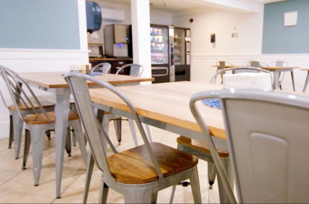Dining area with wood tables and metal chairs
