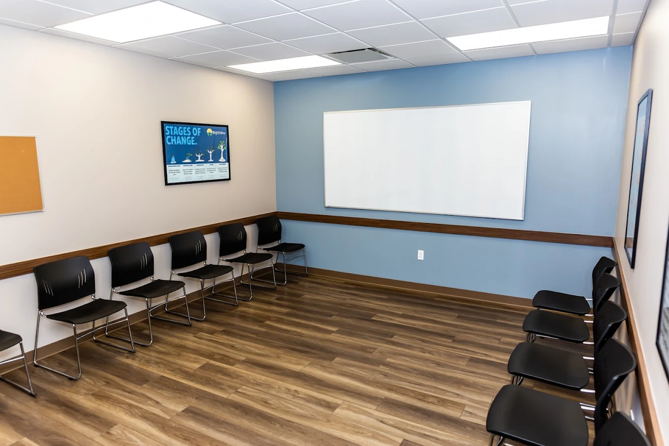 Group therapy room with chairs arranged along the walls