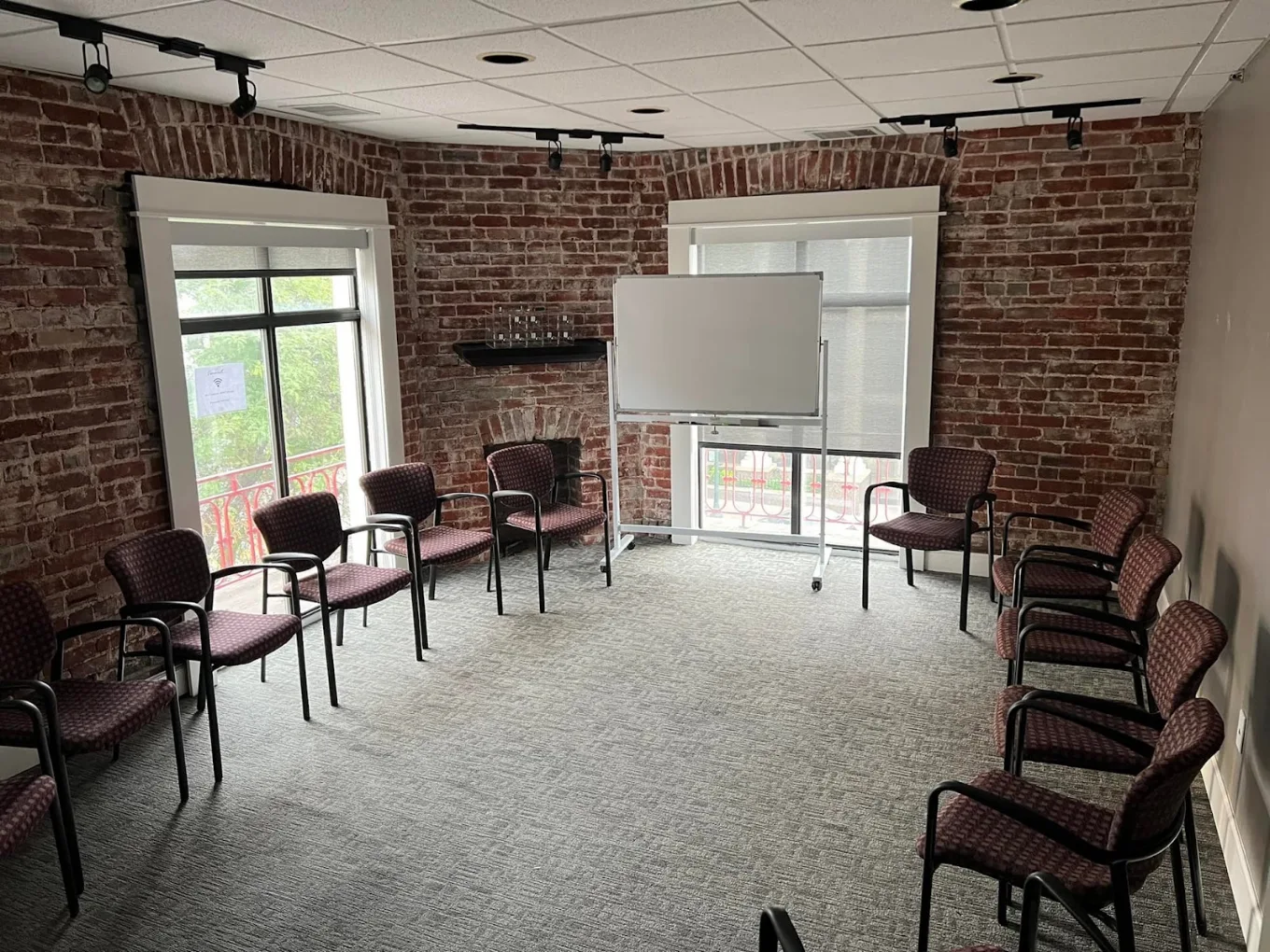 Group meeting room with chairs and whiteboard