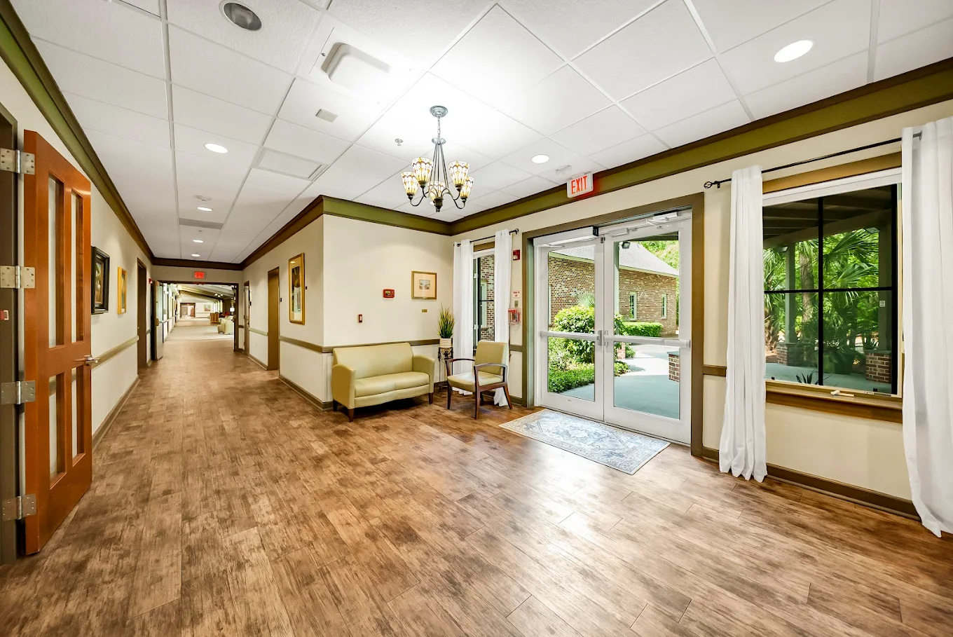 Spacious hallway with seating and garden views
