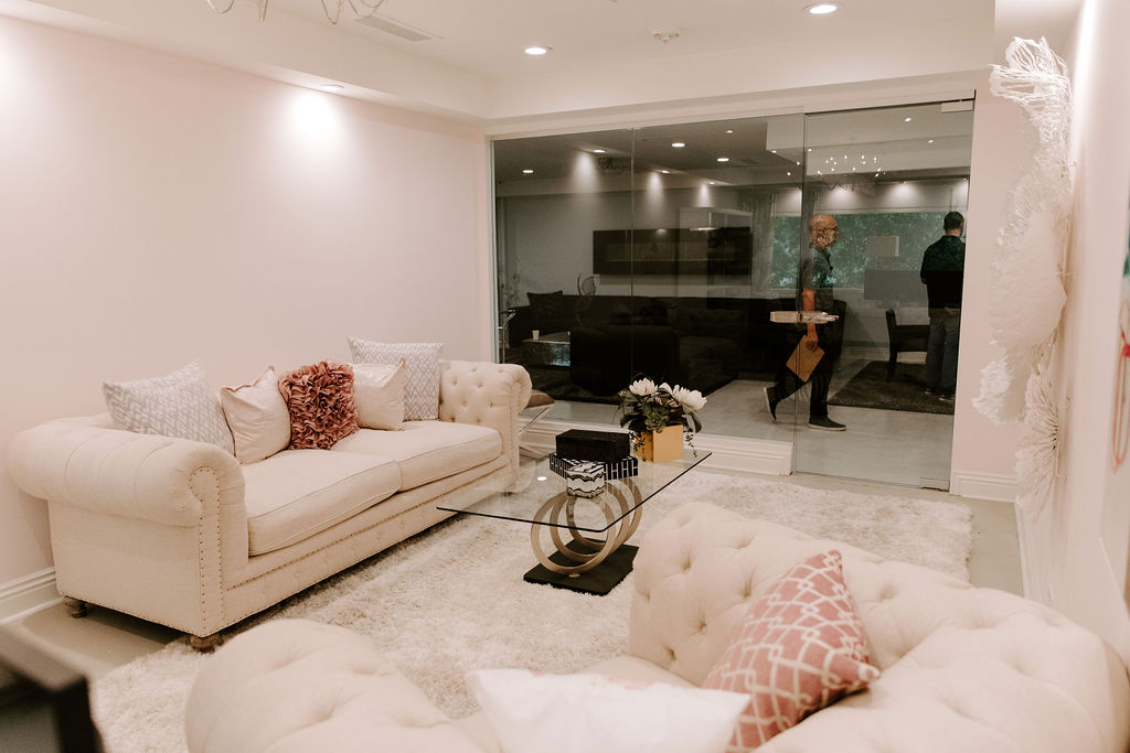 Bright lounge with white sofas and glass coffee table
