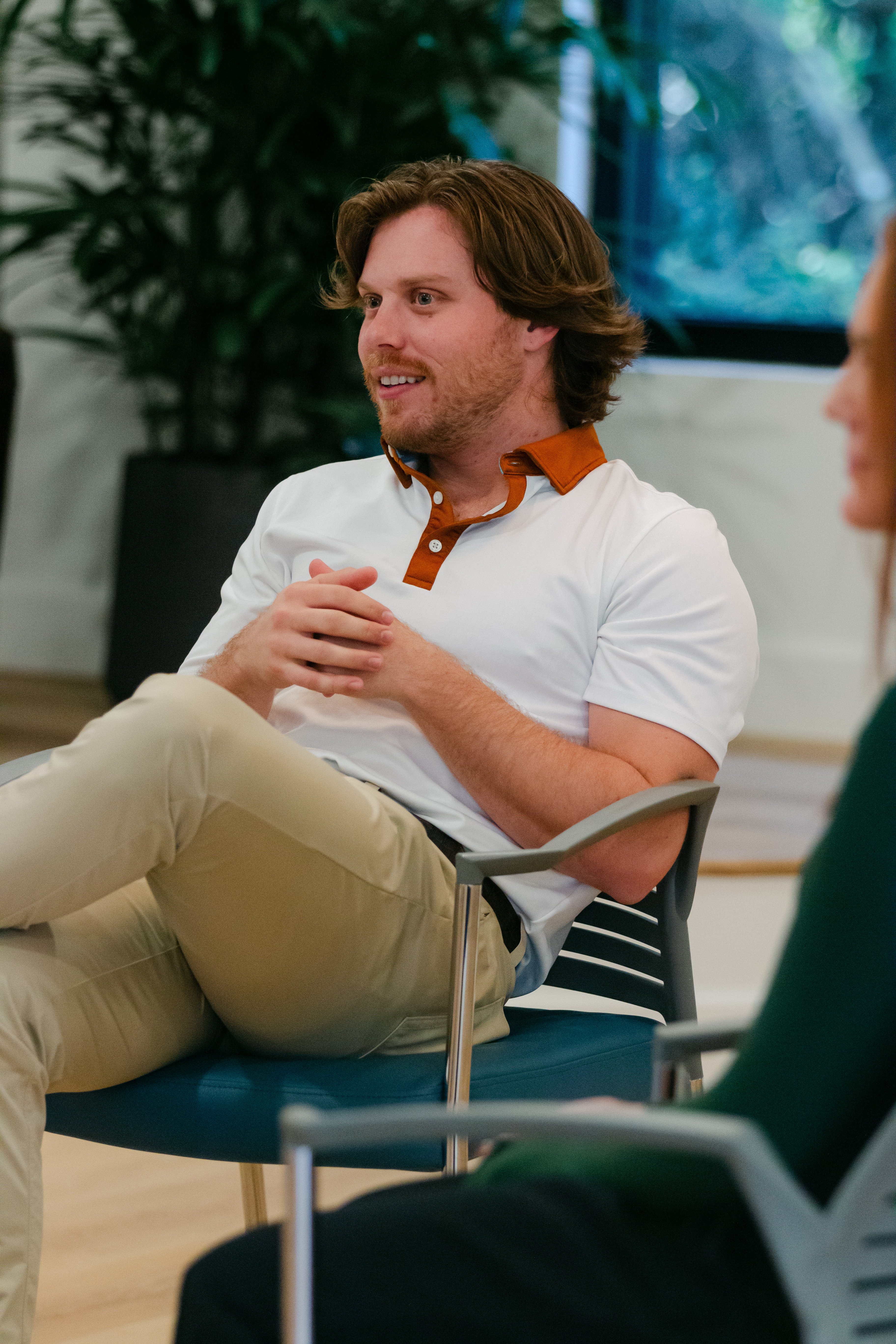 Man speaking during indoor group therapy session