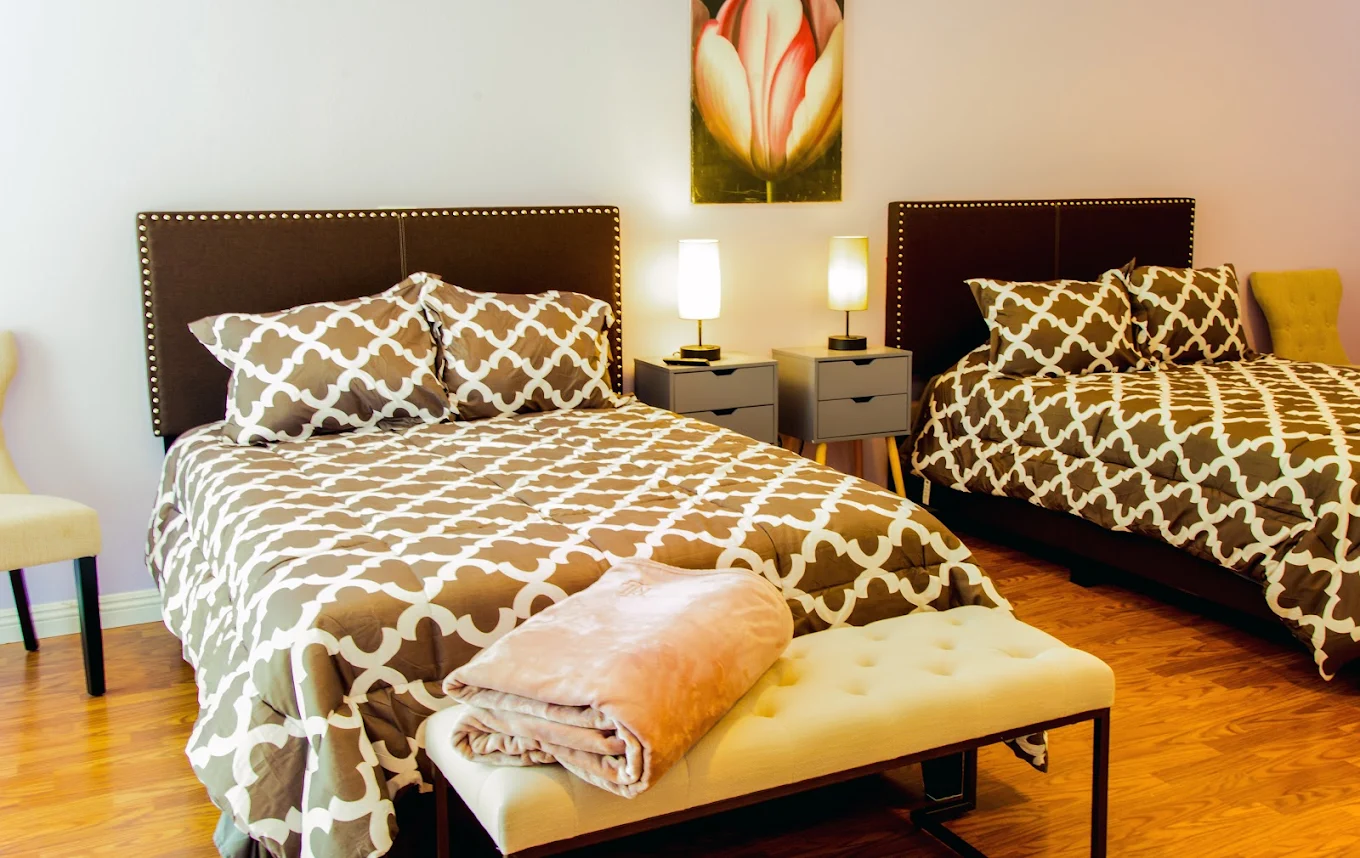 Shared bedroom with two beds at West Valley Detox