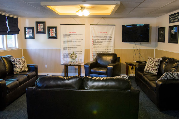 Leather sofa face a TV in a movie room