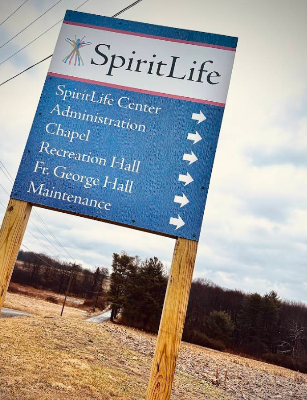 SpiritLife campus sign pointing to chapel, recreation hall, and buildings