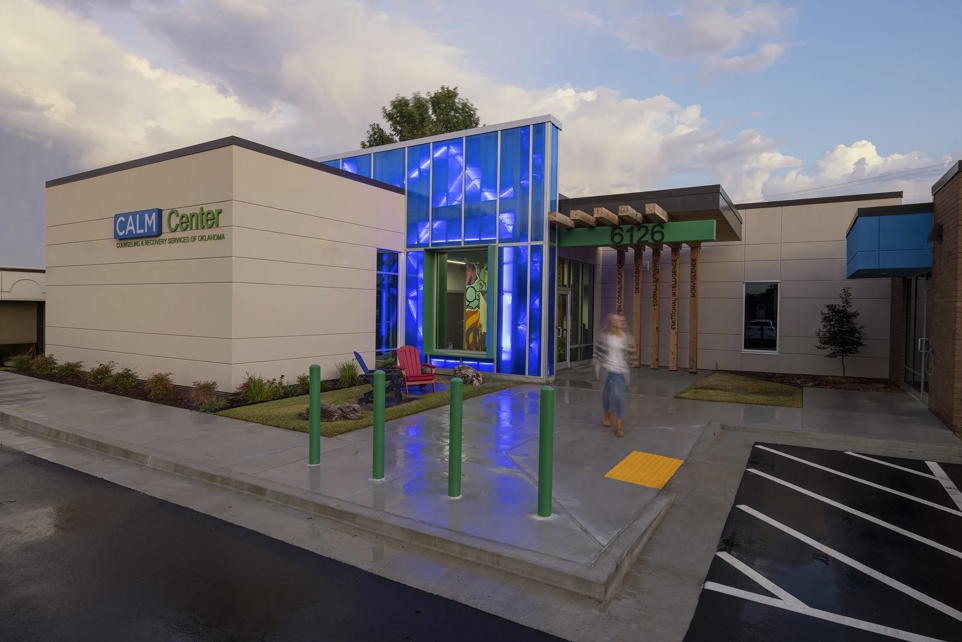 CALM Center exterior with illuminated blue entrance