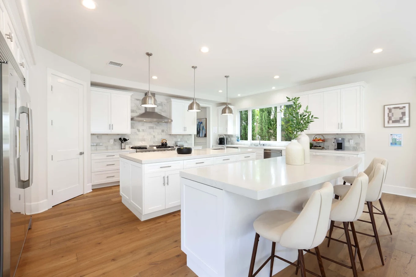 Modern white kitchen with island and bar seating
