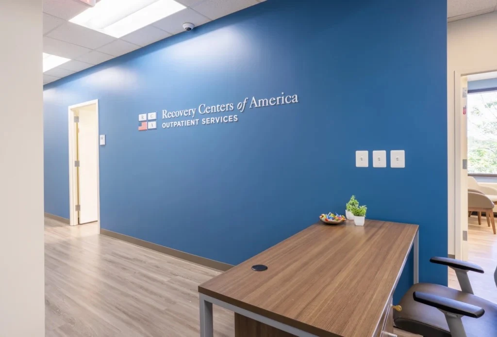 Reception desk with Recovery Centers of America wall sign