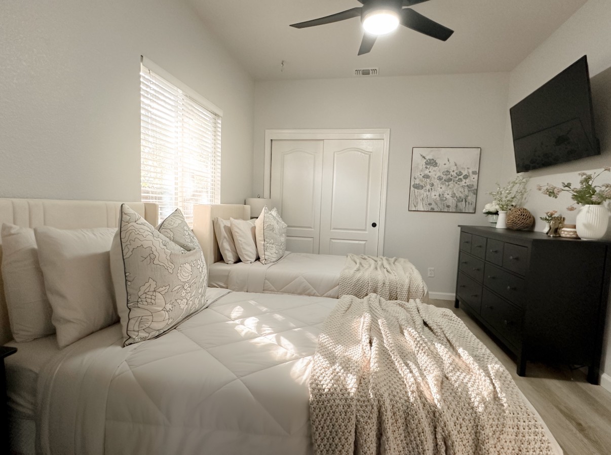 Shared bedroom with two beds and modern furnishings
