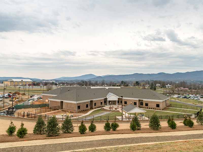 Aerial view of Mount Regis Center treatment campus with surrounding mountain landscape