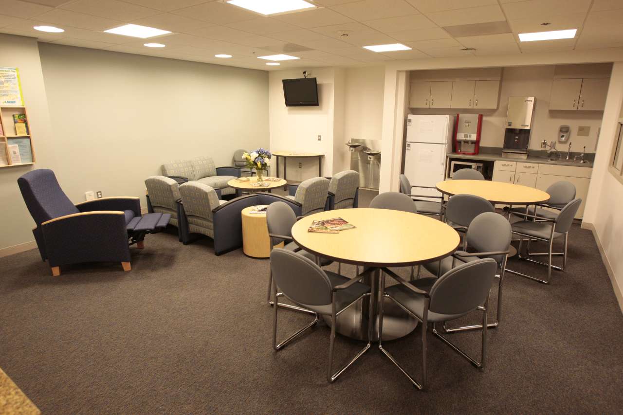 Community room with seating and dining tables