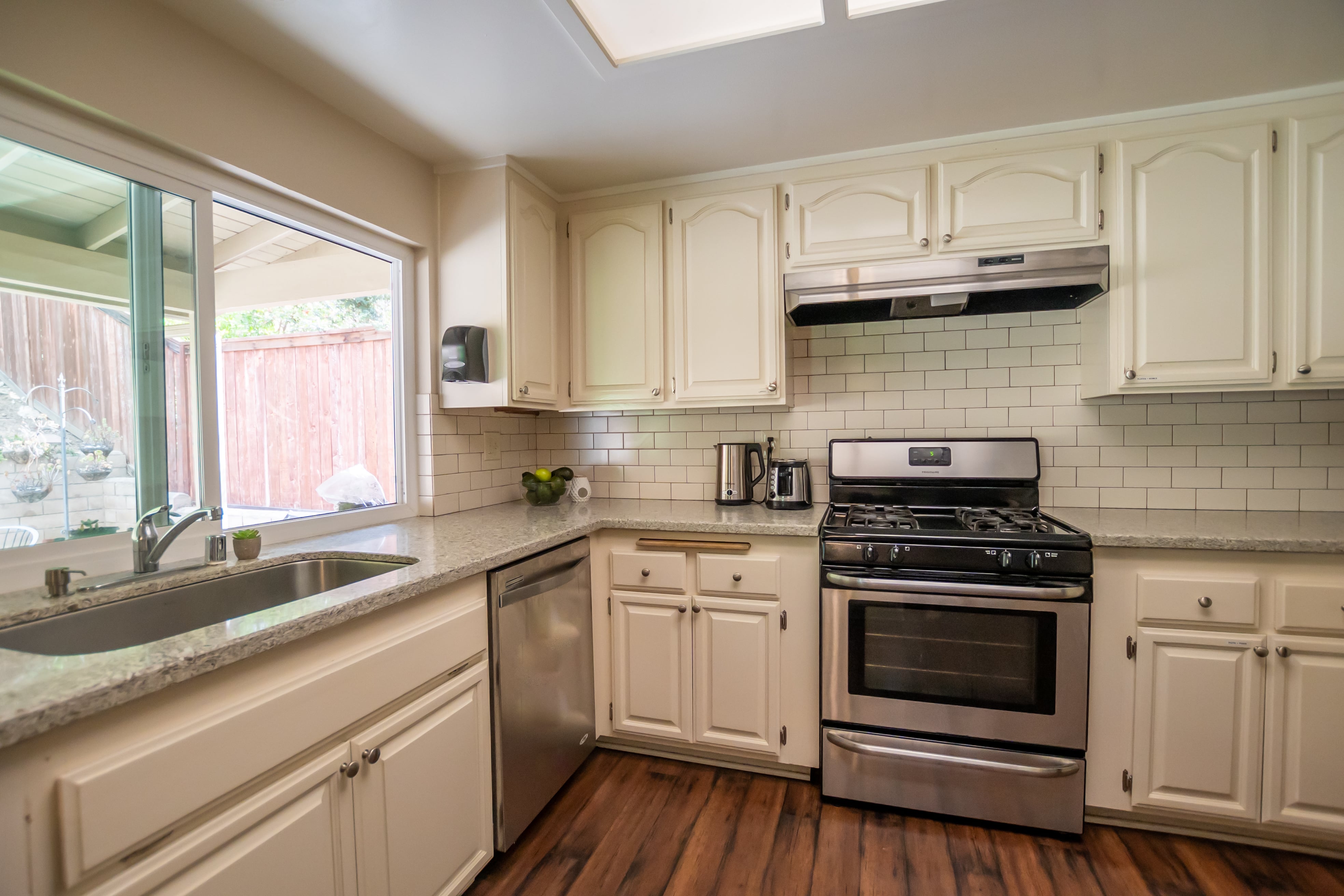 Kitchen with stainless steel appliances and white cabinets