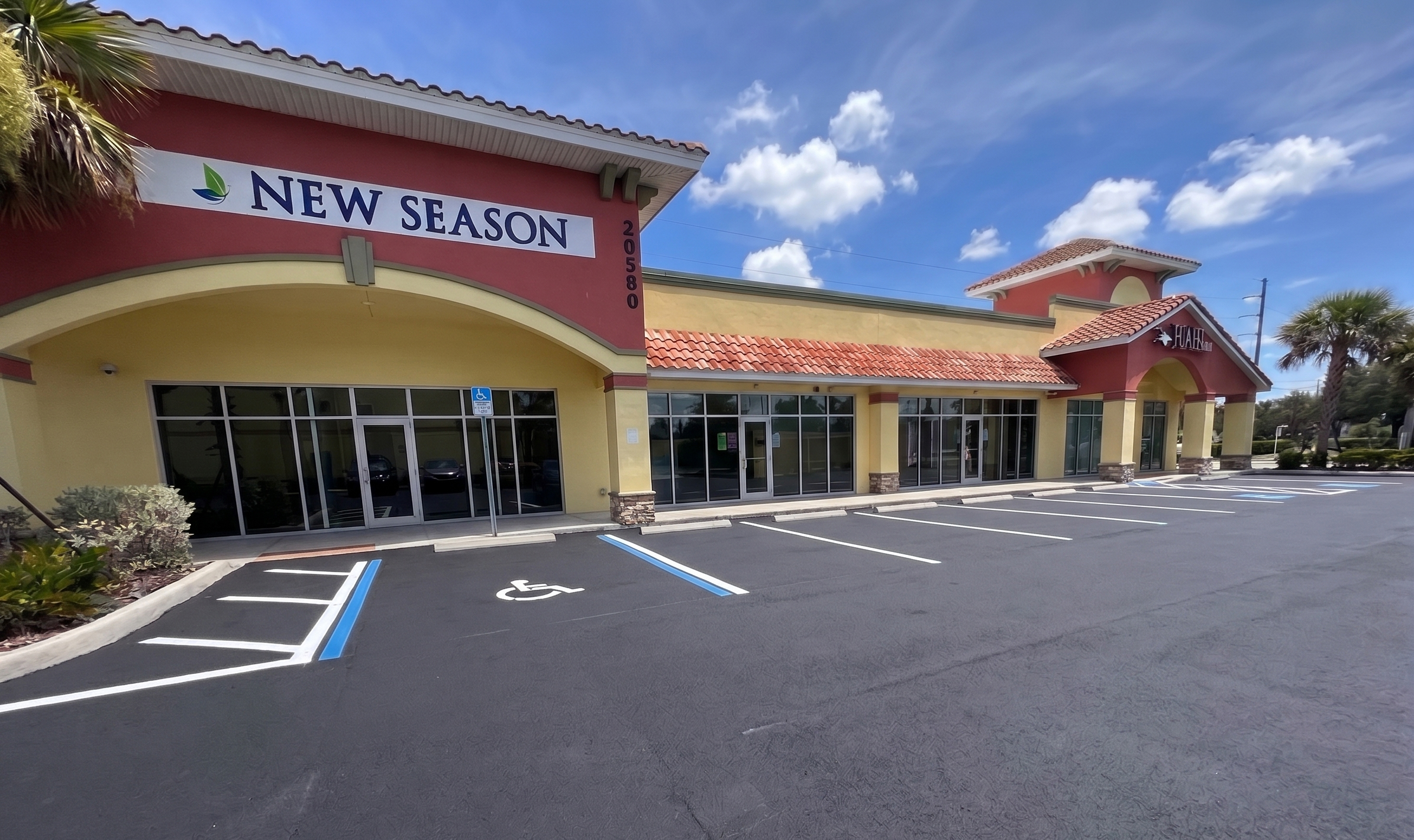 New Season exterior with accessible parking and storefront entrance