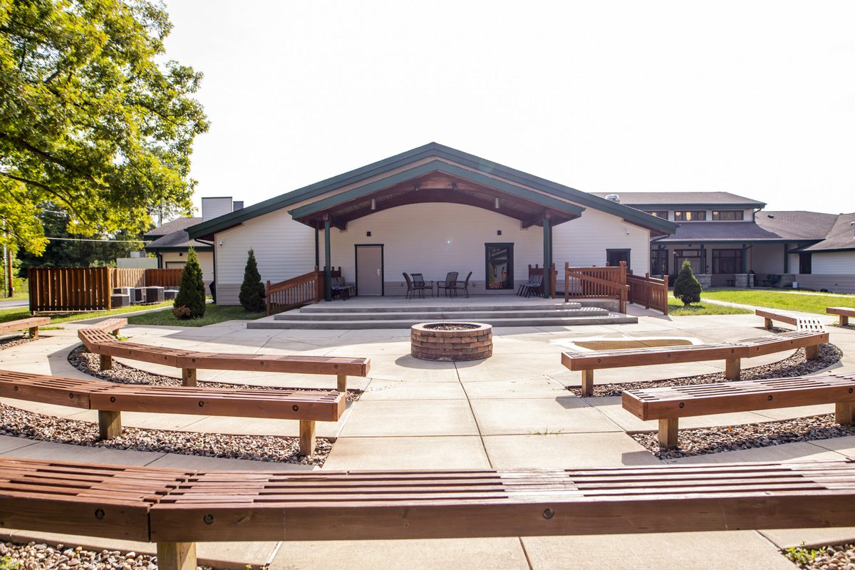 Courtyard with fire pit and amphitheater benches for groups