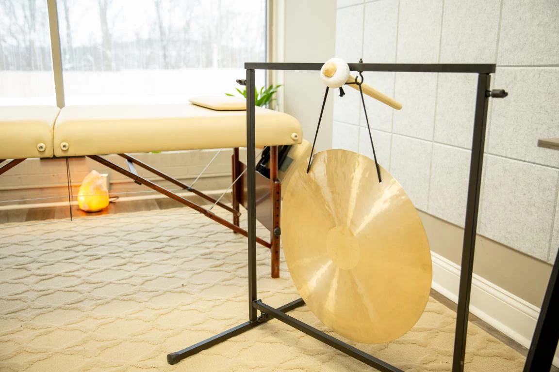 Massage table with gong and salt lamp