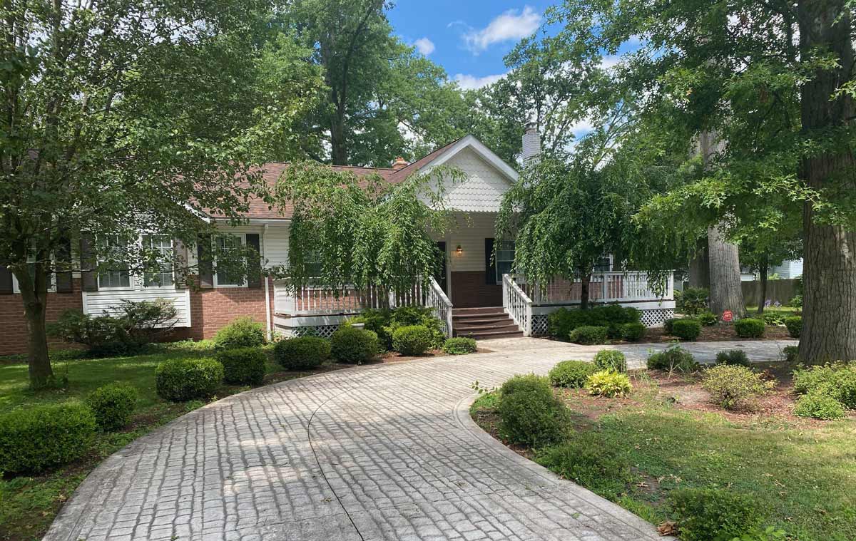Residential-style extended housing surrounded by trees
