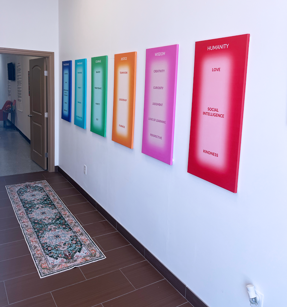 Hallway with colorful inspirational posters on the wall.