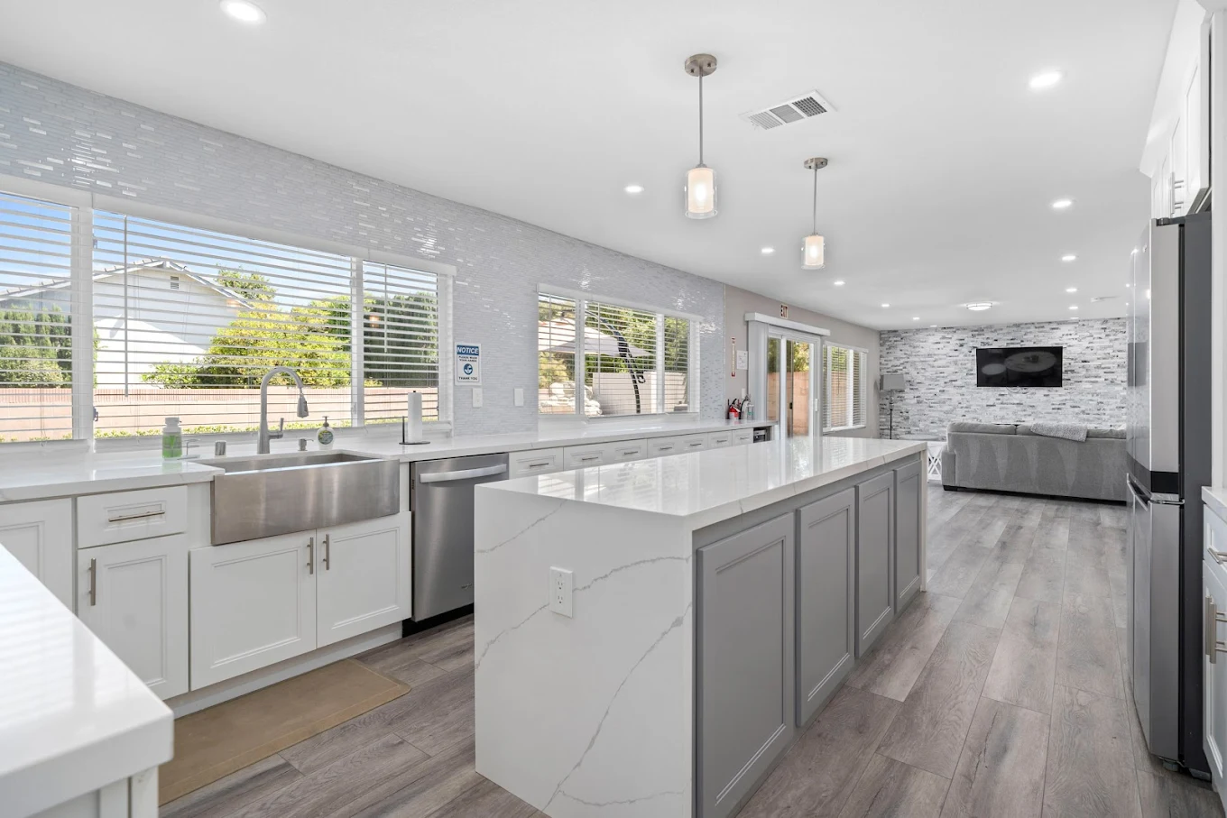 Bright kitchen with island and stainless steel sink