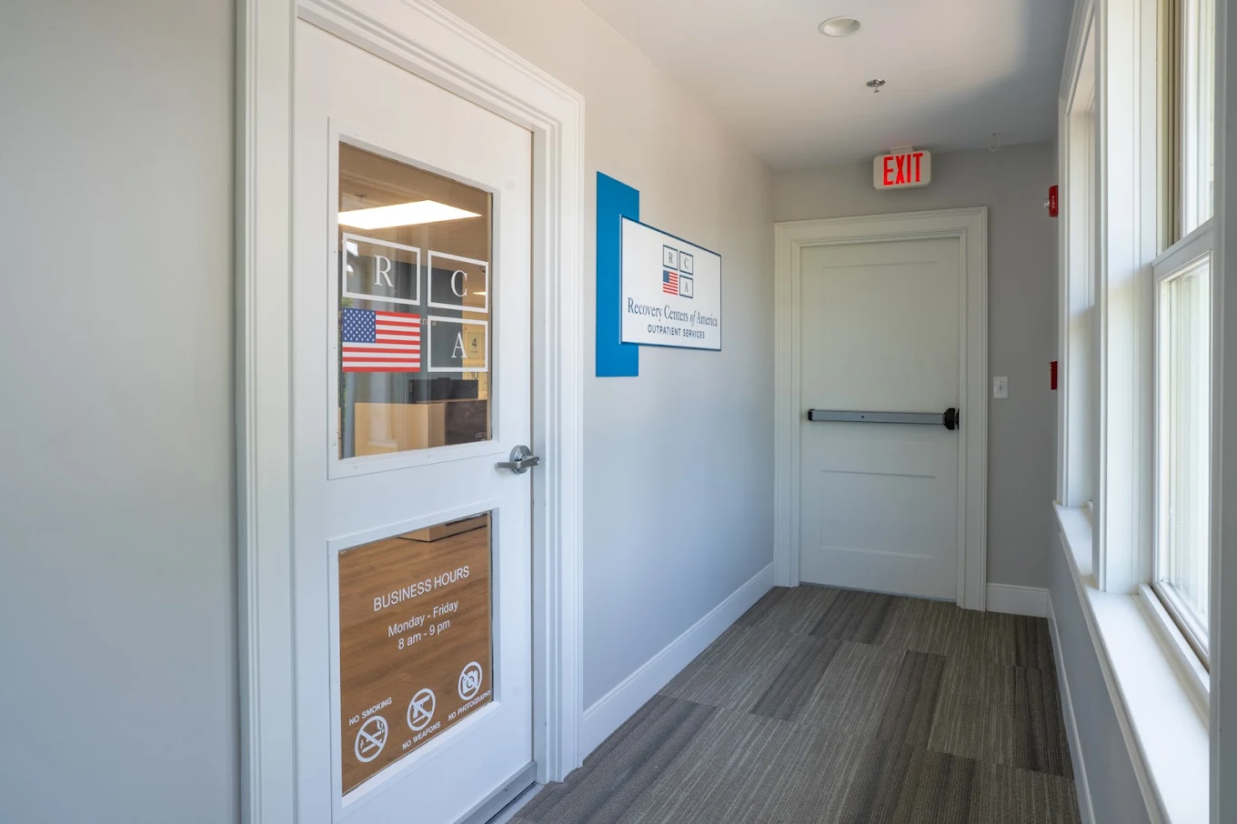 Entrance hallway with outpatient services sign and exit door