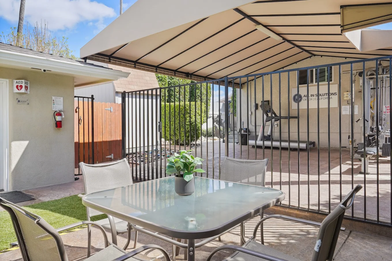 Patio table near gated fitness area