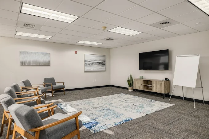 Counseling room with chairs and TV for group sessions