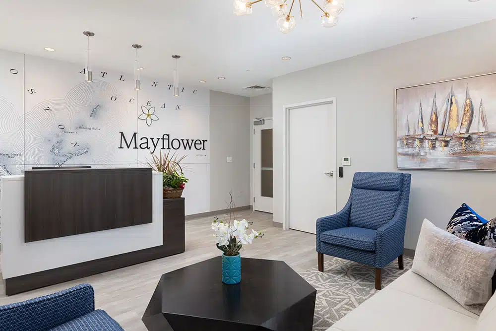 Reception area with seating, artwork, and Mayflower sign